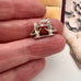 Vintage silver London Bridge charm in someones fingers