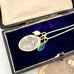 Necklace with a vintage religious pendant in an open jewelry box