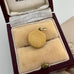 Vintage reverse carved lucite horse charm on an old jewellery box