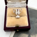 Silver FA Cup trophy-shaped pendant in a jewelry box on a white surface