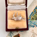 Vintage silver  Mayflower ship charm in a jewelry box with a vintage card in the background