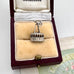 Vintage silver cable car charm in a jewelry box with 'Melbourne' branding