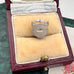 Silver fox head pendant/charm in a jewelry box with 'SILVER' engraved on it.