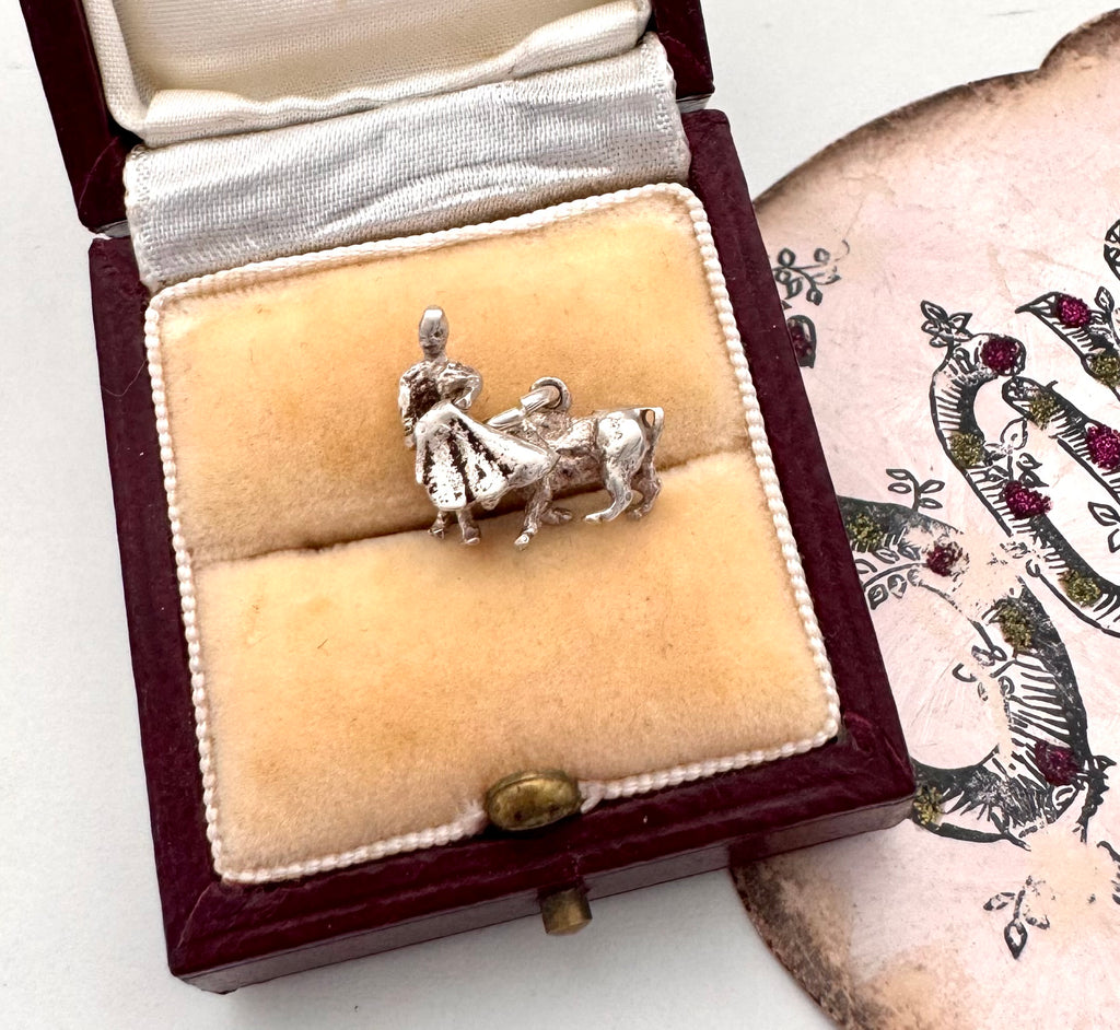 Vintage silver bullfighter charm on a jewellery box