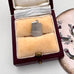 Silver pendant in a jewelry box with a visible 'Silver' stamp on a white background.