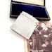 Vintage 1935 hallmarked vesta case made by G&SC Ltd of Regent St, London with a black box and vintage photo of children on a white background