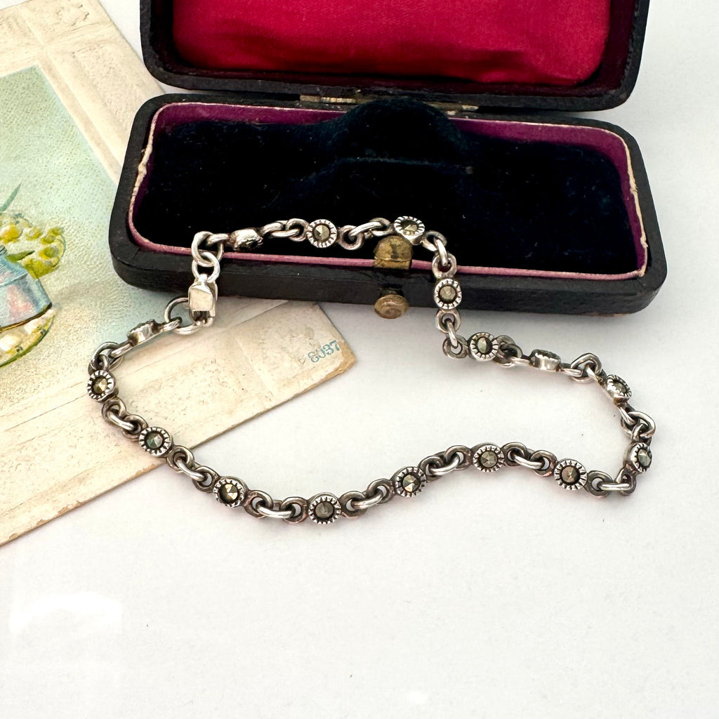 Vintage sterling silver and marcasite bracelet on a vintage jewellery box 