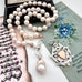 Vonk Jewellery 1900 watch fob and pearl necklace with a vintage postcard and jewellery box