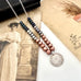 Vonk Jewellery pearl and silver 1904 threepence necklace on vintage postcards