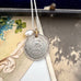 Vonk Jewellery 1911 British sixpence and pearl charm necklace on some vintage postcards