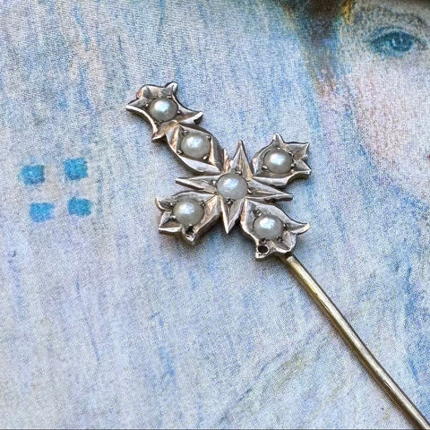 Vonk Jewellery Aronsons 9ct gold and pearl crucifix stick pin on a vintage postcard and with a vintage jewellery box