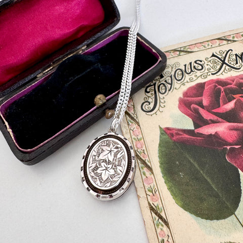 Vonk Jewellery 1884 Victorian silver locket on a vintage post card and a vintage jewellery box