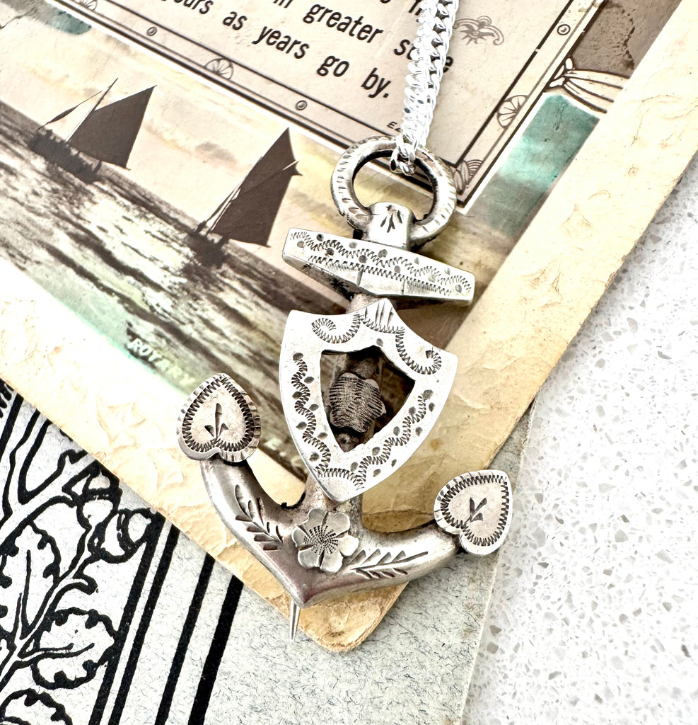 Vonk Jewellery antique silver anchor brooch necklace on a vintage postcard