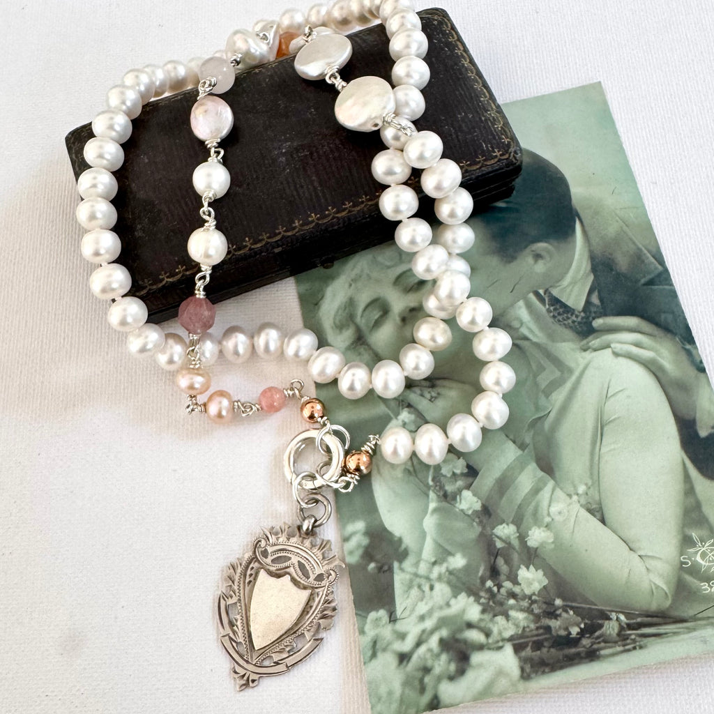 Vonk Jewellery antique watch fob pearl long necklace on a vintage postcard