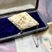 Vonk Jewellery antique bone brooch on a vintage jewellery box and postcard
