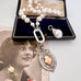 Vonk Jewellery 1931 watch fob and pearl necklace on a vintage postcard and vintage jewellery box