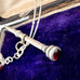 Vonk Jewellery Victorian sterling silver propelling pencil with garnet and pearl charms with a vintage postcard and box