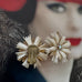 Vonk Jewellery vintage German clip on earrings on a photo of a woman wearing a red hat