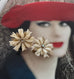 Vonk Jewellery vintage German clip on earrings on a photo of a woman wearing a red hat