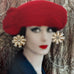 Vonk Jewellery vintage German clip on earrings on a photo of a woman wearing a red hat