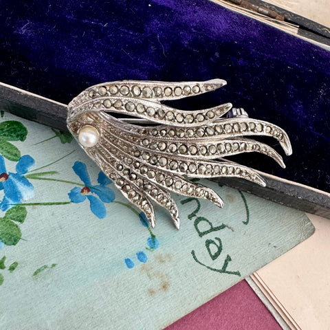 vonk Jewellery vintage marcasite wave brooch on a vintage postcard and jewellery box