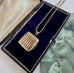 Vonk Jewellery vintage rolled rose gold square locket necklace on a vintage jewellery box