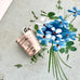 Vonk Jewellery vintage silver articulated bucket charm on a vintage postcard