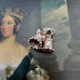 Vonk Jewellery vintage silver bells and ribbon charm on a portrait on a young Queen Victoria