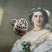 Vonk Jewellery vintage silver opening heart ring box charm on a portrait of an 18th century woman.