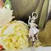Vonk Jewellery vintage sterling silver Scottish Highland Dancer charm on a green and yellow background