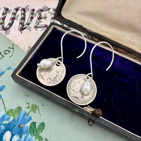 Vonk Jewellery antique coin and pearl drop earrings on a vintage box and with vintage postcards