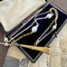 Vonk Jewellery antique pocket watch key necklace on a vintage jewellery box.