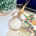 Vonk Jewellery double sided photo locket on a vintage Christmas postcard