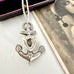Vonk Jewellery antique silver brooch anchor necklace with a vintage postcard of a woman