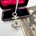 Vonk Jewellery antique silver brooch anchor necklace with a vintage postcard of a woman