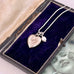 Vonk Jewellery vintage silver heart and pearl charm necklace on a vintage jewellery box