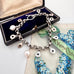 Vonk Jewellery repurposed Victorian chain bracelet with pearl drops and on a vintage postcard and jewellery box