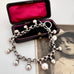 Vonk Jewellery repurposed Victorian chain bracelet with pearl drops and on a vintage postcard and jewellery box