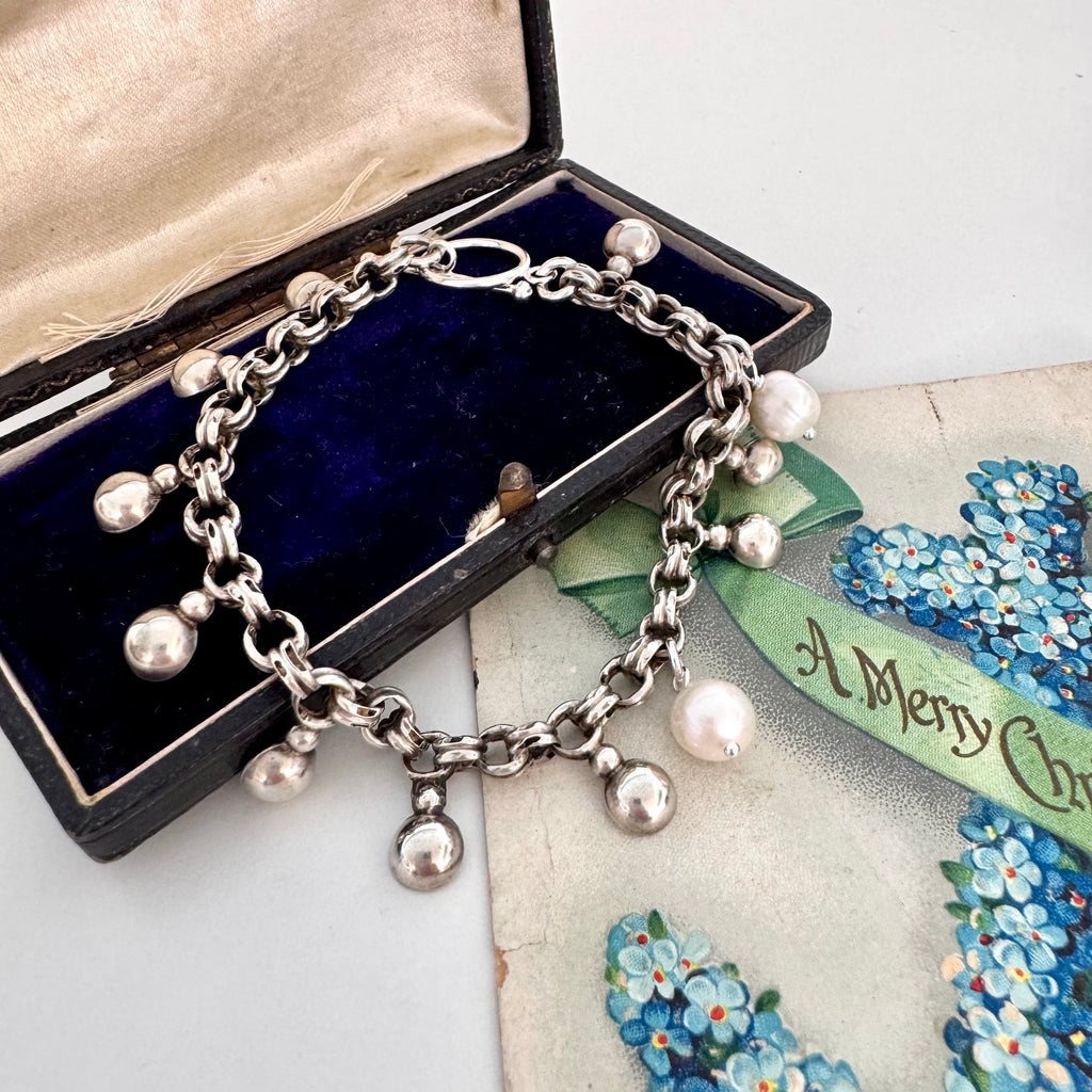 Vonk Jewellery repurposed Victorian chain bracelet with pearl drops and on a vintage postcard and jewellery box