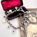 Vonk Jewellery repurposed Victorian chain bracelet with pearl drops and on a vintage postcard and jewellery box