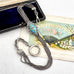 Antique French silver albertina chain  with a turquoise and white stone pendant, displayed next to its dark velvet box and an antique-style fan illustration.
