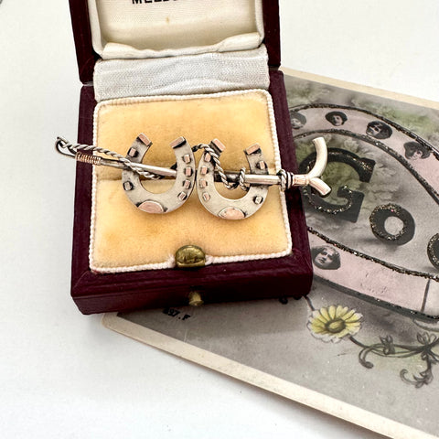 Antique silver horseshoe and riding crop brooch  in a vintage jewellery box