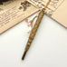 Vonk Jewellery gold tone art deco propelling pencil necklace with pearl charms on vintage postcards