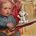 Vonk Jewellery silver teddy bear charm on an old picture of a child from a Womans Weekly magazine