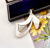 Silver Norwegian Ivar T Holth brooch on a floral card with an open jewelry box in the background