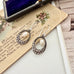 Vonk Jewellery vintage marcasite and pearl earrings on a vintage postcard