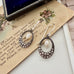 Vonk Jewellery vintage marcasite and pearl earrings on a vintage postcard