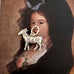 Vintage silver goat charm on an Old masters portrait of a Spanish woman