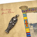 Silver sarcophagus charm on a 'Greetings from Cairo' themed card with an Egyptian column design.